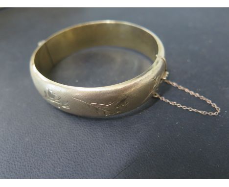 A 9ct gold bangle 1992 Birmingham hallmark C & F maker 6.5cm x 6cm - total weight approx 22 grams - good overall condition, m