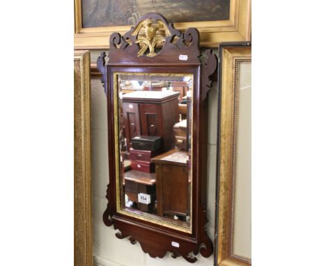 George III style Mahogany and Parcel Gilt Fret carved Mirror with carved Ho Ho Bird to the pediment, 70cms x 40cms 