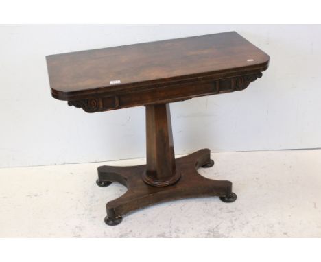 William IV Rosewood Fold-over Card Table raised on hexagonal column support, shaped platform base with four squat bun feet, 9