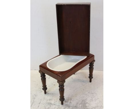 George III Mahogany Bidet and Cover with white ceramic pan, 61cms wide x 44cms high 