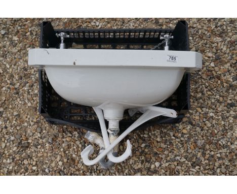 A vintage white ceramic sink complete with taps by Henry Tovey &amp; Son of Cirencester. 