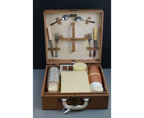 A mid 20th century Army and Navy stores cased picnic set. 