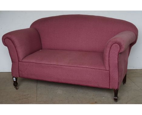 Late 19th / Early 20th century Drop End Sofa, upholstered in pink fabric and raised on square tapering legs with castors, 136