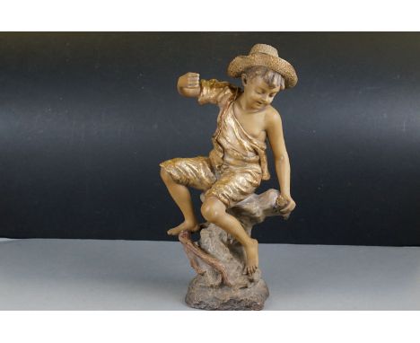 Goldscheider Cold Painted Terracotta Model of a Boy with Fish seated on a Rock, impressed marks to rear ' (a/f), 44cms high 