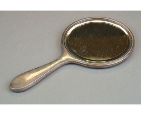 A fully hallmarked sterling silver backed hand mirror, assay marked for Birmingham and dated for 1927. 