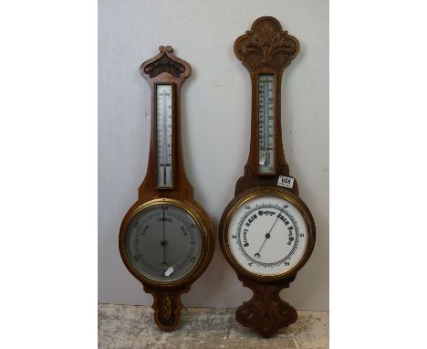 A 20th century oak cased banjo barometer together with one other similar. 