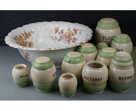 A collection of ceramic storage jars with green stripe pattern together with a large ceramic wash basin. 