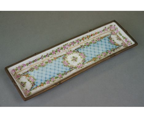 A Continental ceramic and enamel pen tray with floral decoration marked with monogram AF to underside.