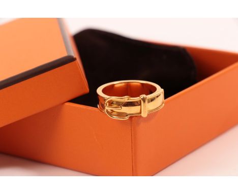 A Hermes Gilt Metal Buckle Scarf Ring,  the yellow plain polished band with a buckle motif to the upper section.  The scarf r