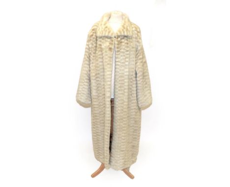 A Cream and Light Grey Checked Mink Long Coat, with slit pockets, the burgundy lining embroidered with gold and pink Oriental