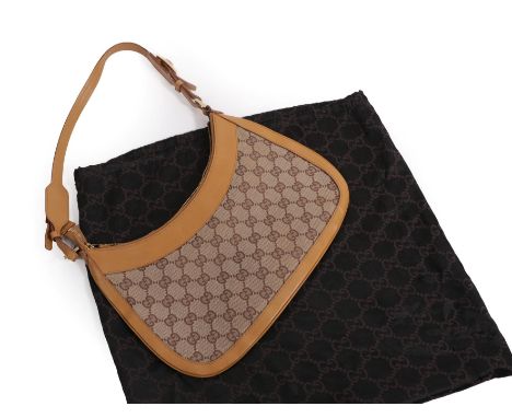 Gucci Small Shoulder Bag, in monogrammed canvas and light tan leather mounts, brass metalware with clip to the front, buckle,