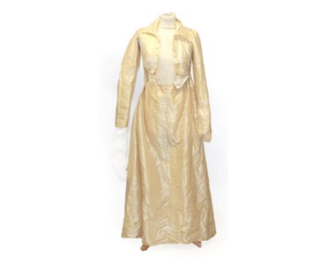 A Circa 1790 English Cream Silk Round Gown, with long sleeves, buttoned bodice with collar and full skirt with pleats to the 