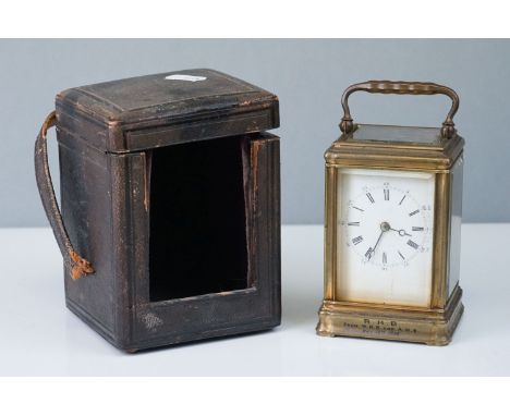 A antique brass cased carriage clock with white enamel dial, marked R.H.B from W.H.S. and A.M.B May 16th 1896, complete with 