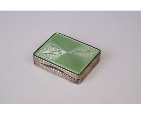 A vintage Art Deco continental silver lipstick compact with green enamel decoration. 