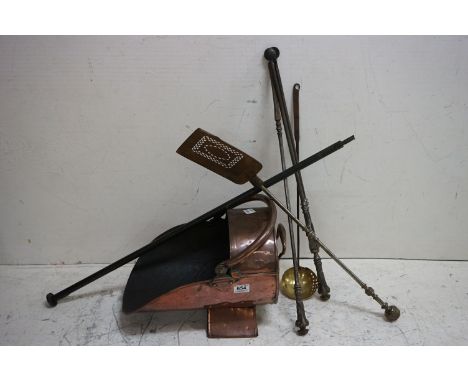 A antique copper coal scuttle together with a quantity of fireside tools. 