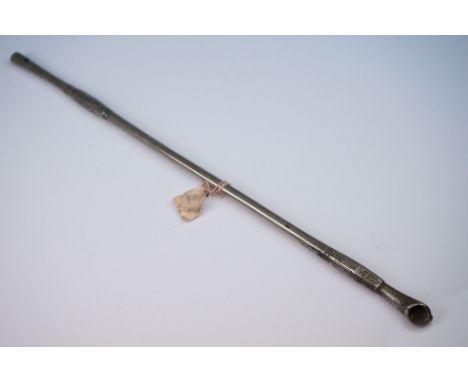 A Chinese opium pipe with engraved decoration, approx 32cm in length. 