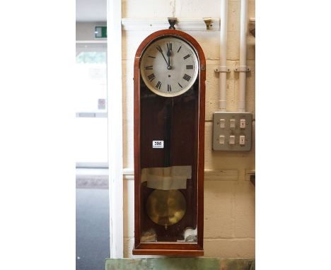 A vintage wooden cased dome topped wall clock. 