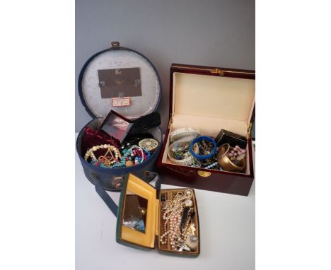 A collection of mainly vintage costume jewellery contained within two boxes to include necklaces, brooches and bracelets. 