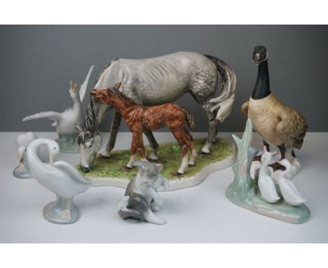 A collection of ceramic animal figures to include Nao and Goebel examples. 