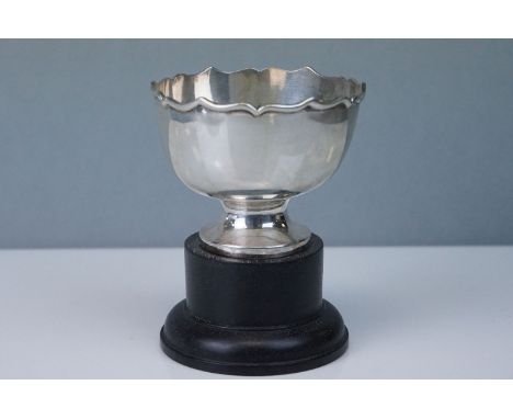 Silver trophy on wooden plinth, made in Hong Kong with maker's mark 