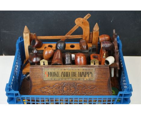 A collection of vintage pipes and pipe racks to include Peterson and Orlik examples 