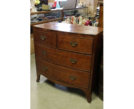 Early 19th century Mahogany and Cross-banded Bow Fronted Chest of Two Short over Two Long Drawers, raised on swept bracket fe