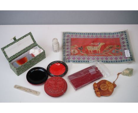 Chinese agate seal, two Chinese cinnabar disk boxes with covers, a resin twin fish resin pendant, a Chinese silk embroidered 