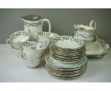 A Aynsley tea set comprising of tea cups, saucers, side plates, tea pot, cake plate, milk jug and sugar bowl. 