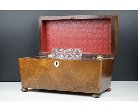Early 19th century Rosewood Tea Caddy of sarcophagus form, the hinged lid opening to two lidded compartment and space for a m