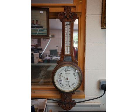 Early 20th century Carved Oak Cased Barometer / Thermometer with white face marked ' J Rattray, Optician, Dundee, Sidric Pate