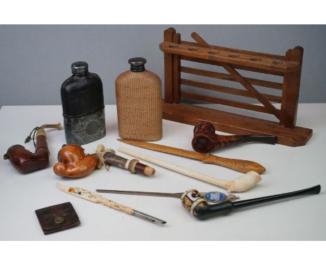 A box of mixed collectables to include pipes, pipe rack, hip flasks and letter openers. 