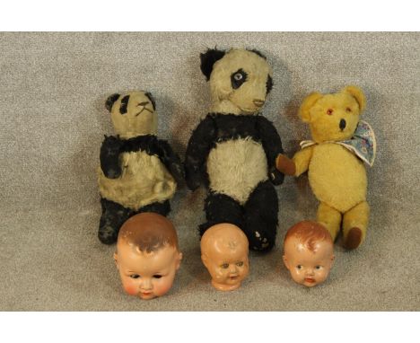 Three 20th century painted papier mache dolls heads, together with a 20th century teddy bear with articulated limbs and two 2