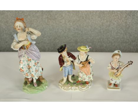 A late 19th/early 20th century painted Dresden porcelain figure of two musicians, painted and impressed marks to base, togeth