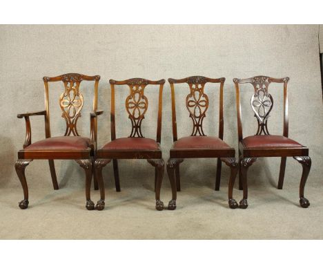 Four 19th century mahogany framed Chippendale style pierced splat single chairs with drop in seats raised on carved cabriole 