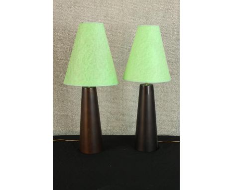 A pair of contemporary black conical ceramic table lamps with green fabric shades. H.80cm. (each). 