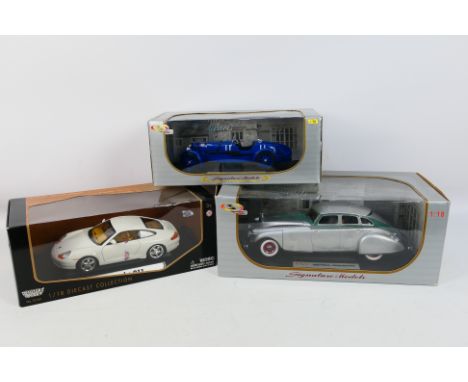 Signature Models - Motor Max - Three boxed 1:18 scale diecast model vehicles. Lot consists of Motor Max Porsche 911; Signatur