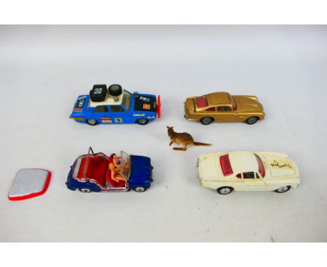 Corgi Toys - Four unboxed diecast model cars from Corgi Toys. Lot includes Corgi #261 James Bond Aston Martin DB5 (ejector se