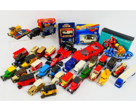 Matchbox - Bburago - Lledo - A collection of models including two unopened Matchbox Dale Farm Ford milk vans, a boxed BMW 325