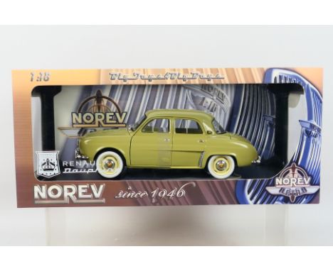 Norev - A boxed Norev #185164 1:18 scale 1958 Renault Dauphine. The model in beige appears to be in Mint condition, housed wi