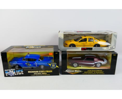 Ertl - UT Models - Three boxed diecast 1:18 American model cars. Lot consists of Ertl #32819 1958 Chevy Impala Michigan State