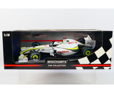 Minichamps - A boxed limited edition 1:18 scale Brawn GP BGP 001 Jenson Button 2009 car # 150090622. It appears Mint in a Goo