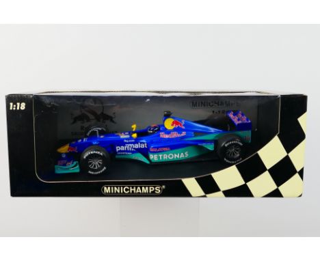 Minichamps- A boxed 1:18 scale Red Bull Sauber Petronas C19 Pedro Diniz car which appears Mint in a Good box with light stora