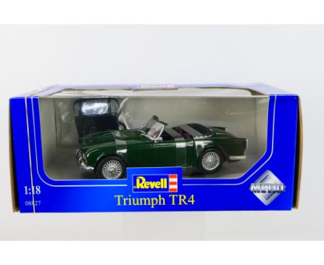 Revell - A boxed 1:18 scale Revell #08827 Triumph TR4. The model in green appears to be in Mint condition, presented within a