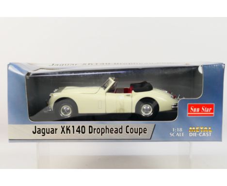 Sun Star - A boxed Sun Star #2803 1:18 scale Jaguar XK140 Drophead Coupe. The model in white appears to be in Mint condition,