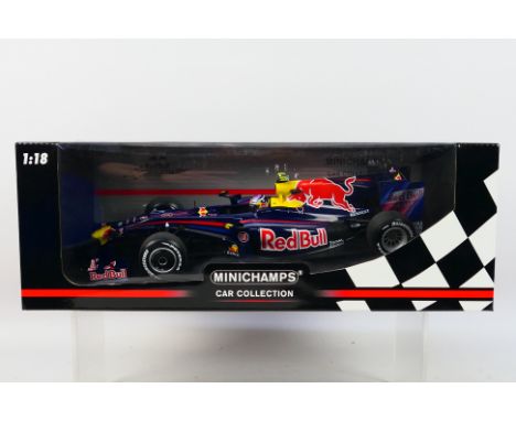 Minichamps - A boxed 1:18 scale Red Bull Racing Renault RB5 Sebastian Vettel 2009 car # 150090015. It appears Mint in a Good 