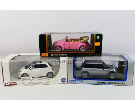 Mondo Motors - Maisto - Welly - Three boxed 1:18 scale diecast model vehicles. Lot consists of Welly Mini Cooper; Maisto 'Spe