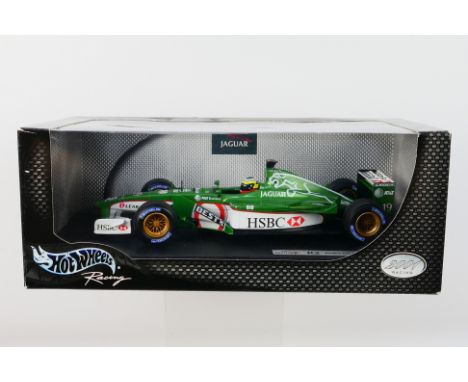 Hot Wheels - A boxed 1:18 scale Jaguar R2 Pedro De La Rosa car which appears Mint in a Good box with some light storage wear 