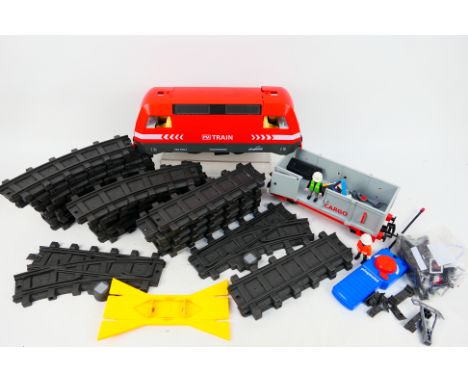 Playmobil - An unboxed Plymobil #4010 remote control Cargo Train Set. The setcomes with train, cargo wagon, track and accesso