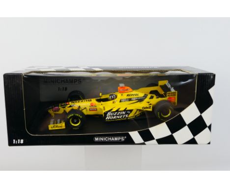 Minichamps- A boxed 1:18 scale Jordan Mugen Honda Damon Hill car which appears Mint in a Good box with some creasing of the w