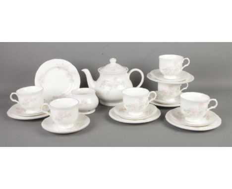A Sadler ceramic six-place tea service in the 'Romance' design. Contains teapot, sugar bowl, cups and saucers and side plates